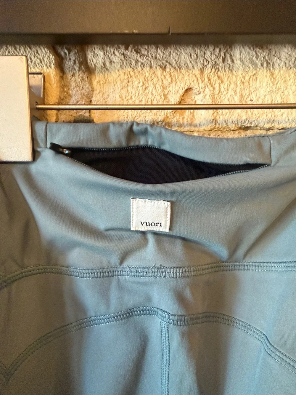 Vuori High-Waist Performance Leggings - Slate Blue with zipper pocket on back